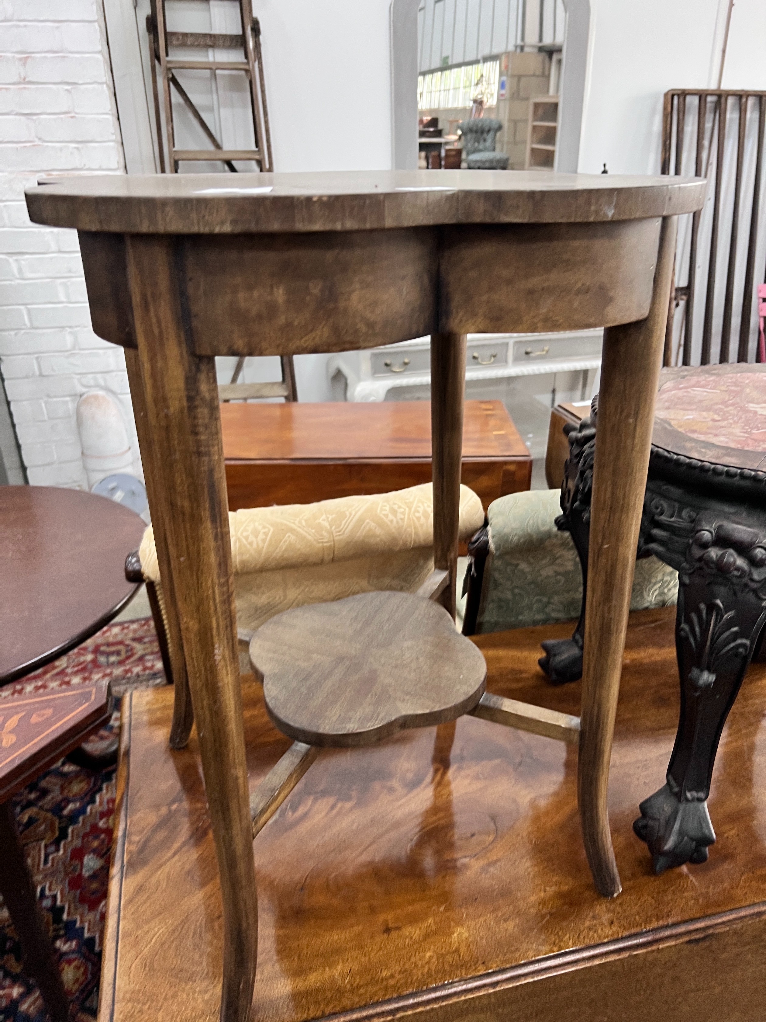 An Edwardian mahogany occasional table, clover-from top, width 55cm, height 70cm *Please note the sale commences at 9am.